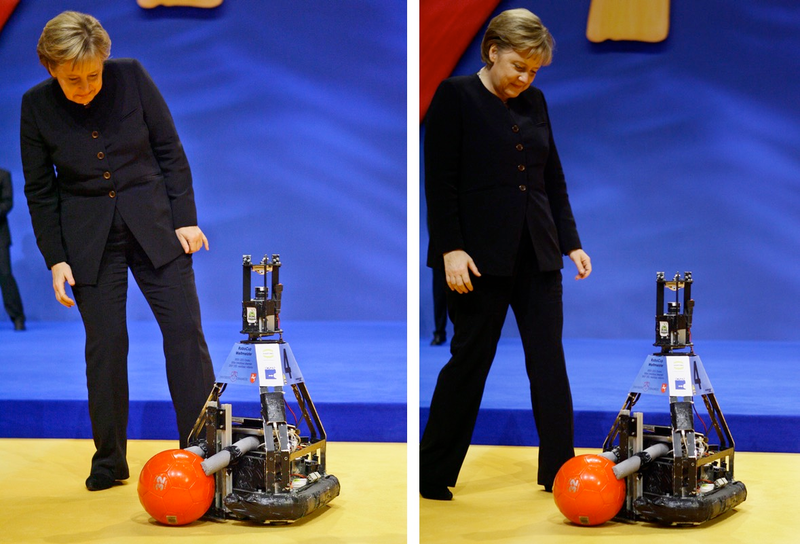Illustration for article titled Why Is Angela Merkel Always Palling Around With Robots?